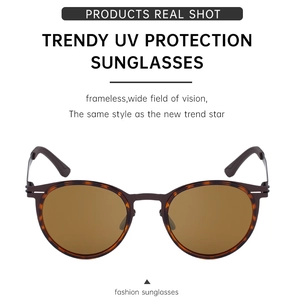 Detail view of oval polarized sunglasses featuring UV protection and tortoiseshell accents