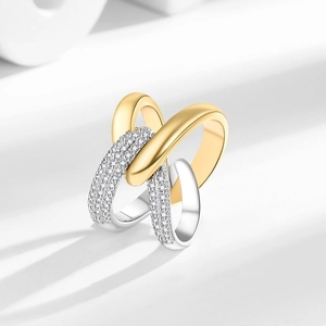 Modern two-tone X-shaped crisscross ring with pavé-set diamonds in gold and silver
