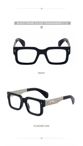 Détail de lunettes de soleil carrées noires avec rivets en flèche argentés et cœur en métal