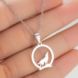 Minimalist stainless steel necklace featuring a round cutout howling wolf silhouette pendant