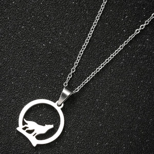 Stainless steel necklace featuring a circular cut-out howling wolf pendant in silver finish