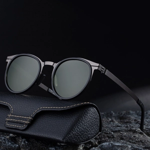 Retro oval polarized sunglasses with gunmetal frame on leather case and black rock