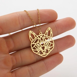 Detail shot of the 18K gold plated hollow geometric cat pendant and delicate thin chain