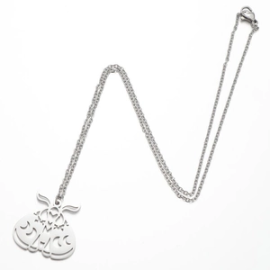 Stainless steel moth pendant necklace with geometric hollow moon patterns on white background
