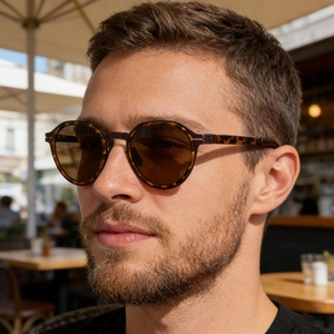 Close-up of polarized round sunglasses with tortoise frame and brown lenses