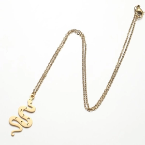 Detail of gold snake pendant with crescent moon cutouts on a fine O-chain necklace