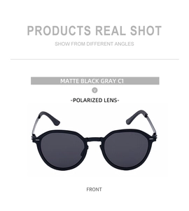 Detailed front view of matte black round polarized sunglasses with gray lenses model C1