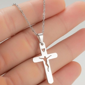 Silver hollow cross pendant necklace with Jesus silhouette on a minimalist chain