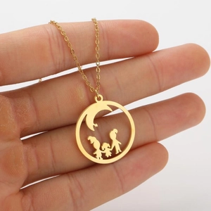 Detailed view of gold circular necklace featuring cutout silhouette of three family members