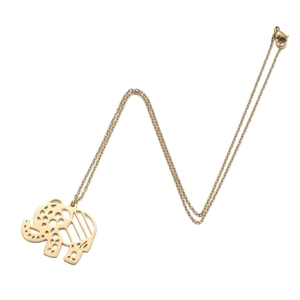 Bohemian gold elephant pendant necklace with geometric cutout patterns on white background