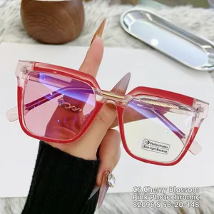 Detail of red and pink cat-eye frame with functional photochromic blue light blocking lens