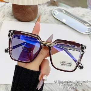 Detail of tortoiseshell photochromic cat-eye glasses with blue light blocking lenses