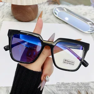Cat eye glasses with photochromic lenses showing transition from clear to grey tint