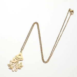 Golden necklace with a detailed mushroom and moon phase pendant on a clean white background