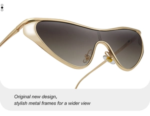 Detailed close-up of premium gold metal frames and brown gradient lenses on oversized sunglasses