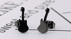Macro shot of minimalist black guitar earrings made of stainless steel with a sleek finish