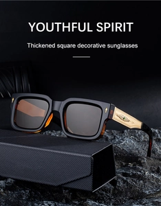 Detail of square sunglasses with gold wing hinge and green gem on black case
