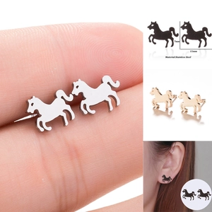Detail showing animal horse stud earrings in silver gold and black stainless steel