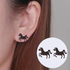 Matte black stainless steel horse stud earrings shown on model with close-up view