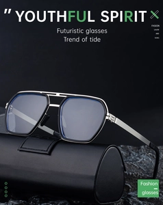 Detail of silver double-bridge sunglasses frame and black leather cylindrical case