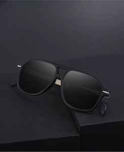 Detailed view of square polarized sunglasses with double bridge and DB7104 model branding