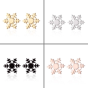 Detail view of snowflake earrings in gold, silver, black, and rose gold finishes