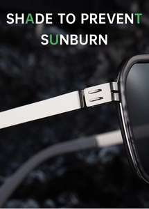 Detail shot of sturdy metal hinges and silver temples on retro double-bridge sunglasses