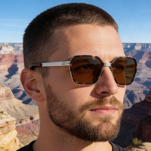 Detail of square vintage sunglasses with tortoiseshell and silver metal frame
