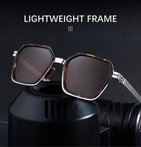 Detail of lightweight tortoise shell sunglasses frame with silver metal inlay accents