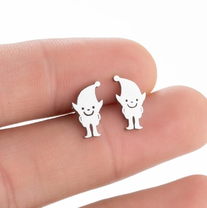 Macro shot of silver clown elf studs showing minimalist face details on polished metal