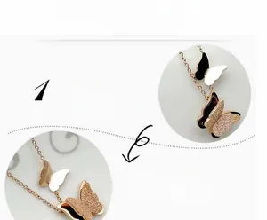 Detail of rose gold butterfly pendant with polished finish and glitter texture on O-chain