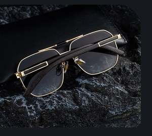 Detailed close-up of square metal frame sunglasses with elegant dark wood grain temples