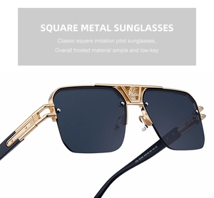 Detailed close-up of golden metal bridge and dark lenses of retro semi-rimless sunglasses