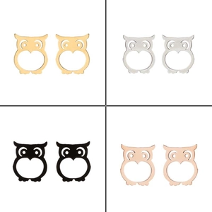 Detail of owl stud earrings set in gold, silver, black, and rose gold stainless steel