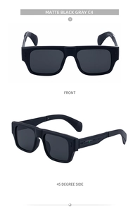 Detail view of matte black square sunglasses with industrial textured temples and gray lenses