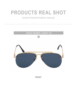 Close-up of pilot sunglasses with gold double bridge frame and gray C4 lenses