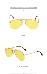 Detail of aviator sunglasses with gold metal frame, yellow lenses and tortoise temple tips