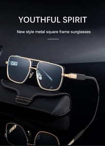 Detailed close-up of metallic square sunglasses with textured temples on leather case