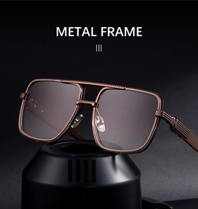 Detail of metal double bridge frame with textured engraving on square sunglasses