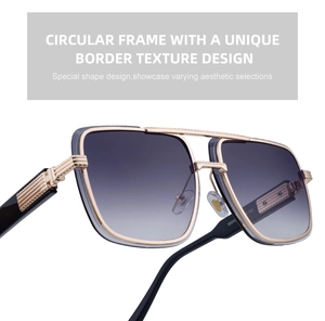 Detail of gold metal aviator sunglasses frame featuring vertical striped texture and gradient lenses