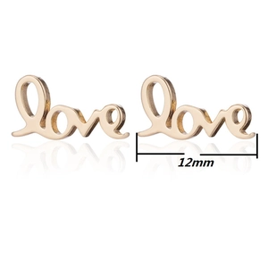 Detail view of gold Love letter stud earrings with 12mm width dimension guide