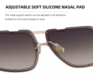 Macro detail of adjustable soft silicone nose pads and gold metal bridge on sunglasses