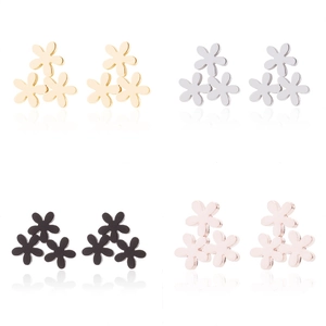 Macro view of clover flower earrings in gold, silver, black and rose gold finishes