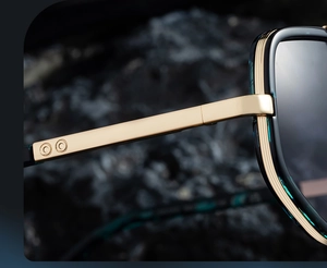 Close-up of gold metal temples and hinge detail on square polarized sunglasses