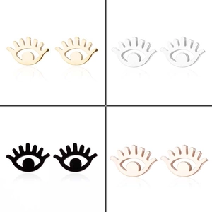 Detail view of eye-shaped stainless steel earrings in gold, silver, black, and rose gold
