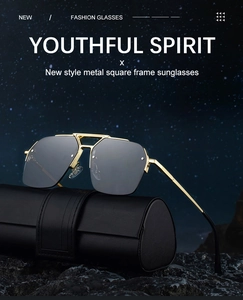 Detail of square semi-rimless sunglasses with gold metal frame on a leather case