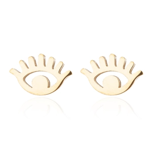 Macro shot of gold devil eye stud earrings with detailed brushed metal texture