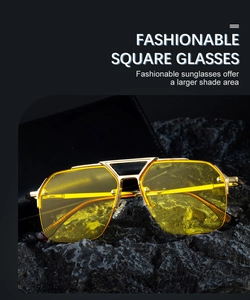 Detailed macro of vintage semi-rimless sunglasses with gold frame and yellow lenses