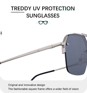 Detail view of silver metal bridge and large square grey lenses with rivet accents
