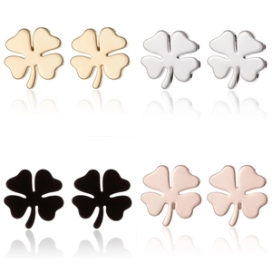 Detail view of four-leaf clover earrings in gold, silver, black, and rose gold finishes